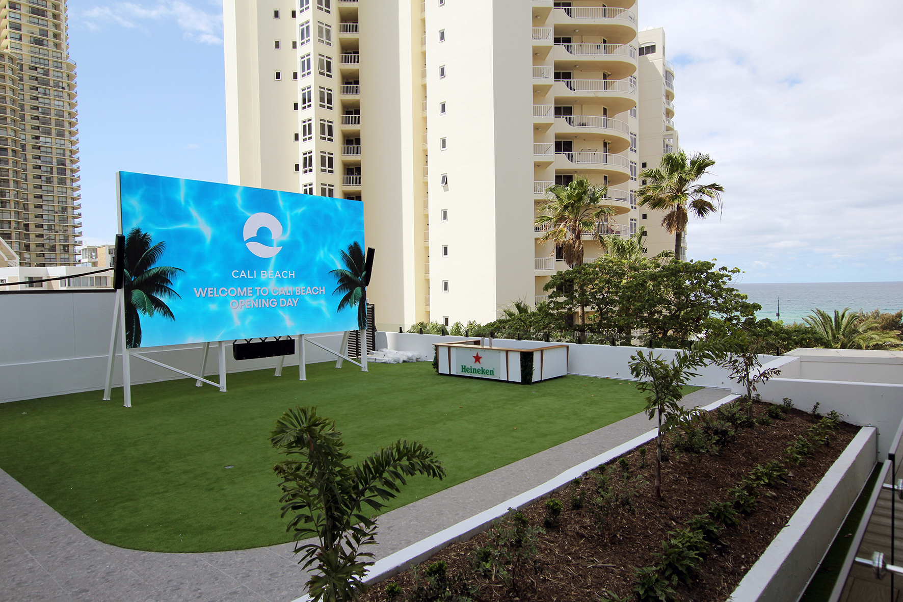 A massive 8m x 4m cinema screen is dominating a back wall of the outdoor moonlight cinema space.